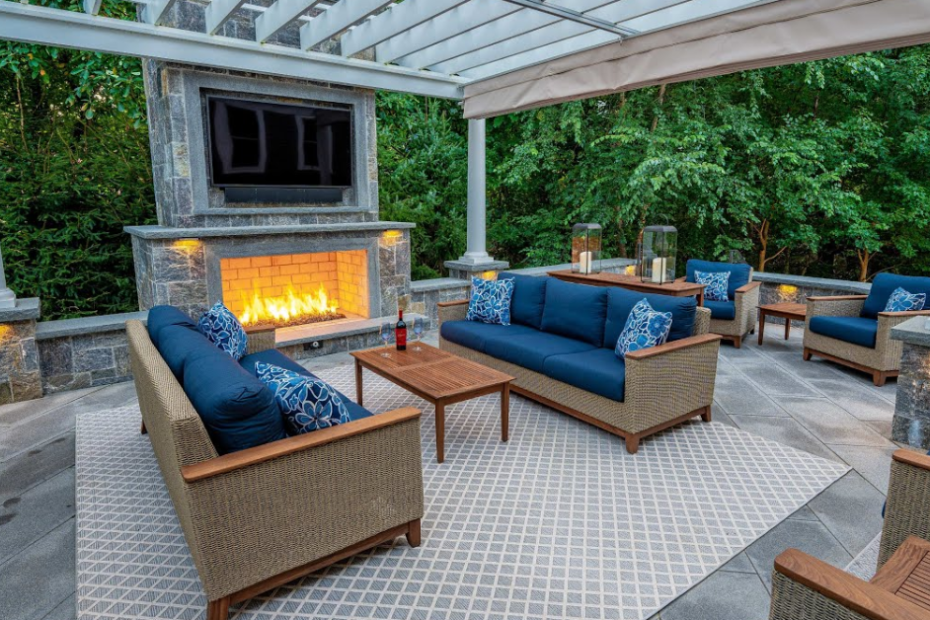 Outdoor living area with seating and fireplace design