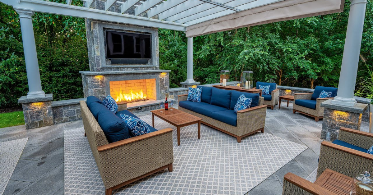 Outdoor living area with seating and fireplace design